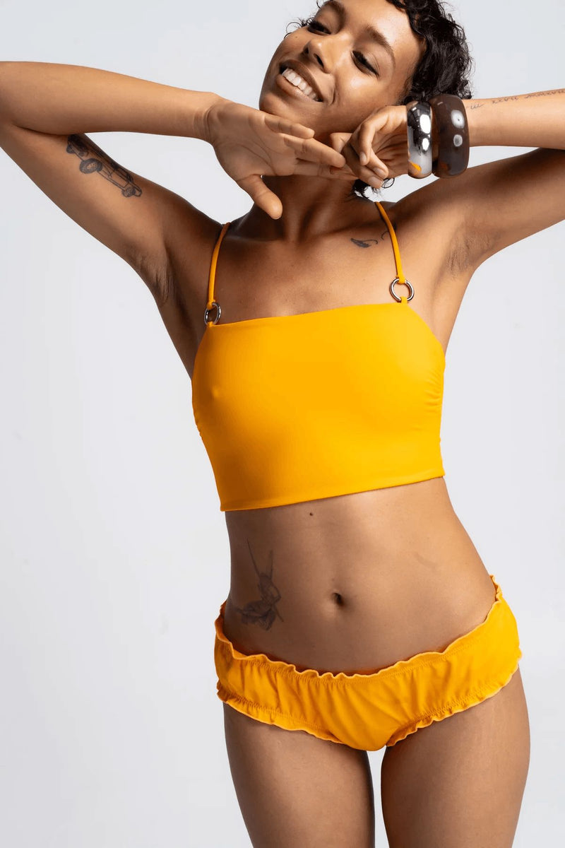 a model in a bright orange bikini