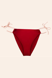 the front of red bikini bottoms with pink ties